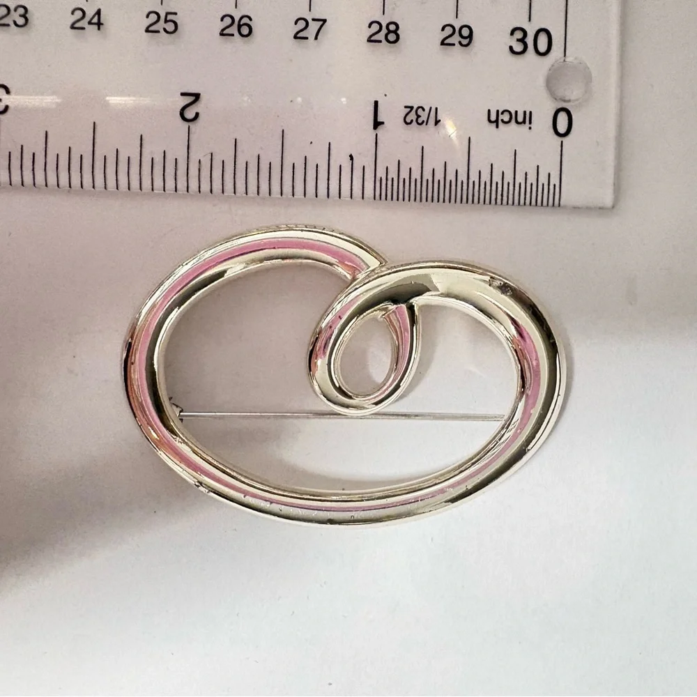 Vintage sign, Monet Silvertone heart shaped swirl Brooch